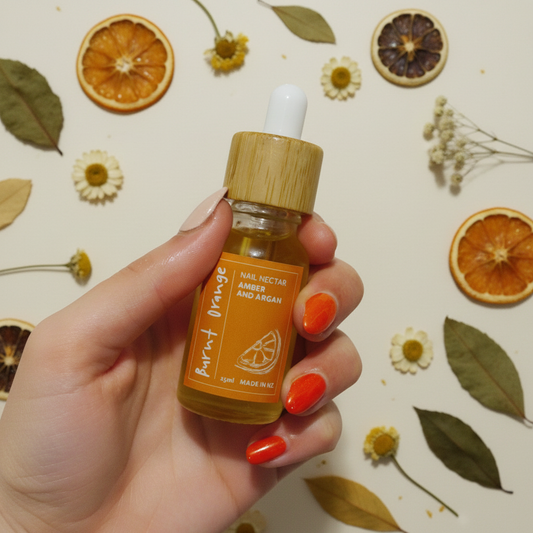 Nail Nectar with dried botanicals background